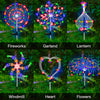 A collection of illuminated lawn decorations including fireworks, garland, lantern, windmill, heart, and flowers.