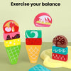 Ice cream stacked high with various flavors and colors, used to exercise balance.