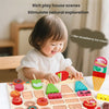 A child plays with a wooden ice cream set featuring various fruit and flavor shapes for a matching game.