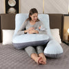 Mujer acostada usando una almohada ergonómica de embarazo con funda extraíble para mayor comodidad.