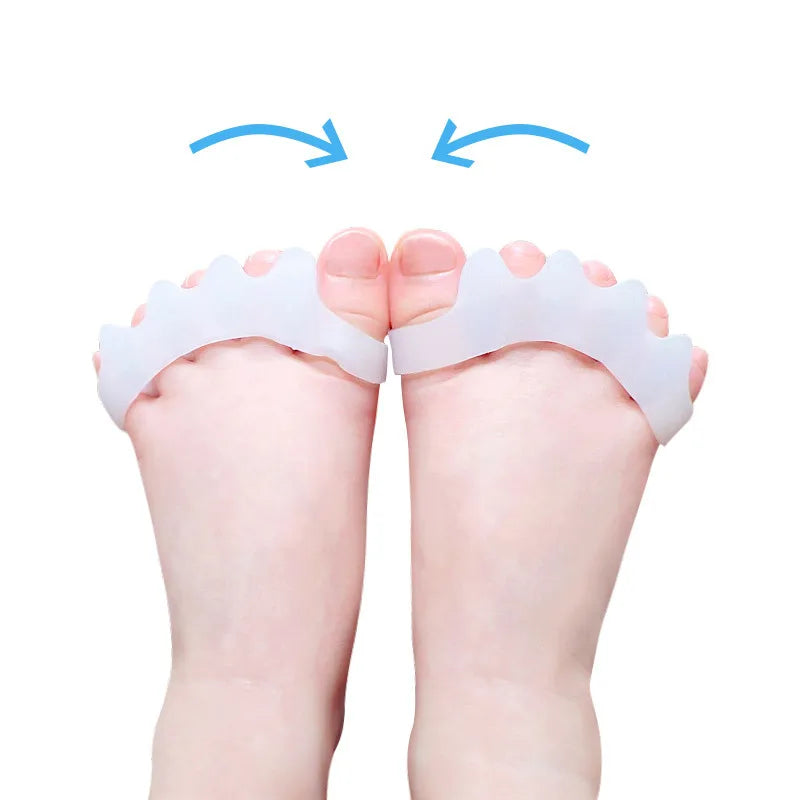 Pair of white soft gel toe separators placed on the feet with blue arrows indicating movement.