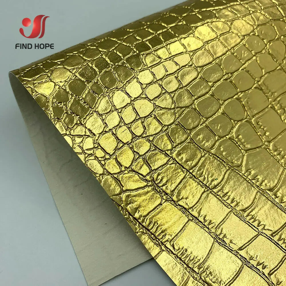 Roll of gold crocodile pattern faux leather fabric for crafting