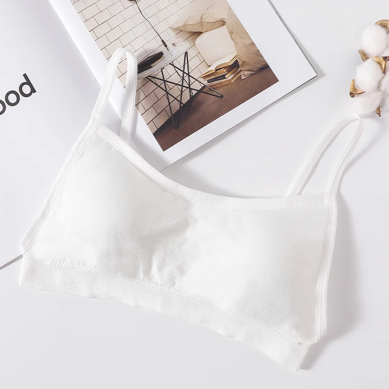 A white seamless U-back bralette with removable pads is displayed on a light background.