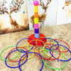 A colorful ring toss game featuring stacked cups and a tall, striped tower for kids.