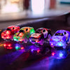 A set of glowing magnetic race cars with ramps and bridges displayed on a dark surface.