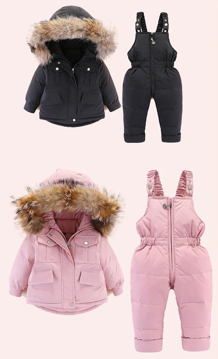 A set of pink baby winter down jacket and pants with faux fur hoods.