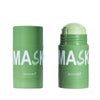 A tube of green tea cleansing stick mask with a light green cap and white text on a white background.