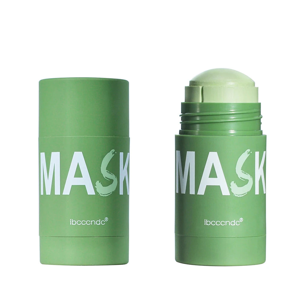 A tube of green tea cleansing stick mask with a light green cap and white text on a white background.