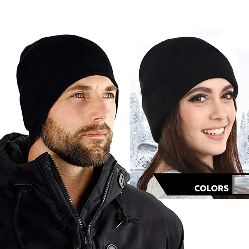 A man wearing a black knitted winter beanie hat and a woman wearing a black knitted winter beanie hat.