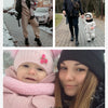 A young woman holds a baby wearing a pink winter down jacket and pants set with a faux fur hood.