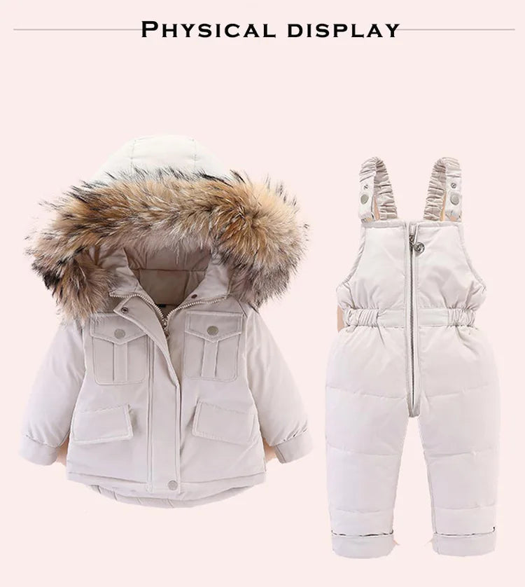 A white baby winter down jacket and pants set with a faux fur hood displayed flat.