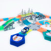 A glowing magnetic race track set featuring ramps and bridges in various colors like orange, green, and blue.