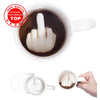 كوب قهوة سيراميك أبيض مملوء بقهوة داكنة وعليه تصميم إصبع الوسطى بارز