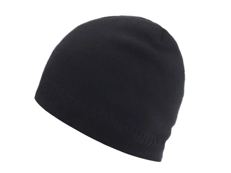 Black cozy knitted winter beanie hat shown from the side.