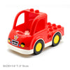 A red city traffic building block vehicle with a trailer and yellow wheels.