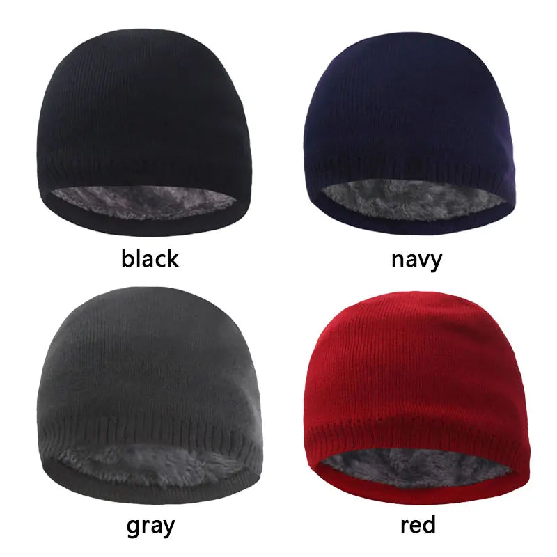 Four knitted winter beanie hats in black, navy, gray, and red shown from the top.