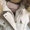 White baby winter down jacket and pants set with a faux fur hood