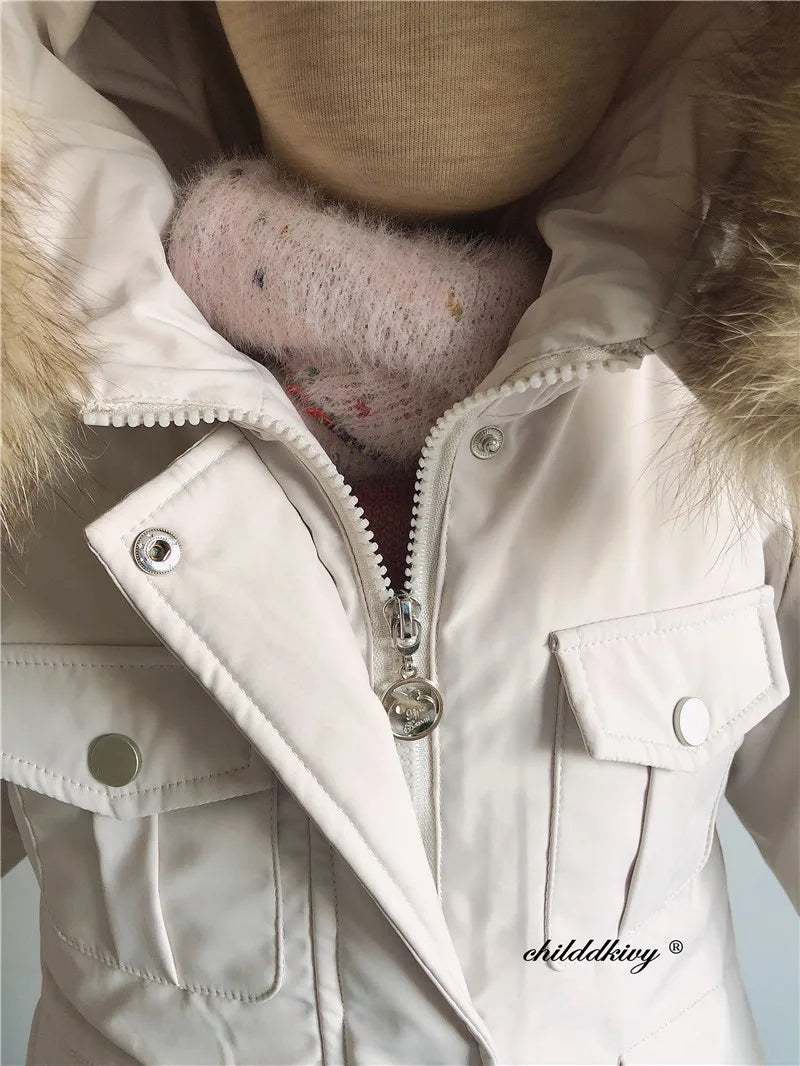 White baby winter down jacket and pants set with a faux fur hood