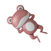 A pink wind-up frog bath toy for toddlers with white accents.