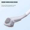 A white silicone toilet brush head with a triangular design and multiple textured sides.