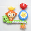 A set of rainbow-colored bath toys featuring duck figures and a water slide.