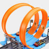 An orange and blue simulation track set for a stunt car racing experience with integrated launchers.