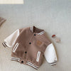 A brown corduroy jacket with white stripes and a cream fleece lining is displayed on a light background.