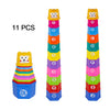 A set of 11 rainbow-colored stacking cups shaped like boats, used for bath and beach fun.