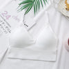 White seamless U-back bralette with removable pads displayed on a white background.