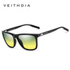 Schwarze Retro-Sonnenbrille mit polarisierten gelb getönten Gläsern auf weißem Hintergrund.