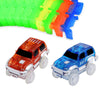 A set of glowing magnetic race track ramps and bridges in green, yellow, orange, and blue colors.