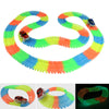 A glowing magnetic race track set featuring ramps and bridges in various bright colors like orange, green, yellow, and blue.