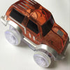 A translucent orange magnetic race track set featuring ramps and bridges with glowing lights.