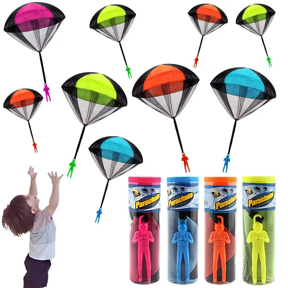 Colección de juguetes paracaídas en varios colores y diseños: negro y rosa, verde, naranja.