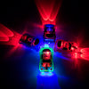 A set of glowing magnetic race track components including ramps and bridges illuminated by red and blue light.