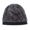 A dark gray faux fur knitted winter beanie hat with a black brim.