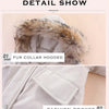Detail show of a light gray winter jacket featuring a faux fur collar and a fashion pocket.