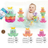 A set of colorful rainbow boat-shaped stacking cups for bath and beach fun, including various sizes.