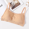 A beige seamless U-back bralette with removable pads is displayed on a white background.