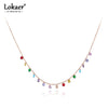 Collar de gargantilla bohemia con cristales colgantes de CZ de colores en cadena dorada.