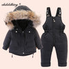 A black baby winter down jacket and pants set with a faux fur hood displayed on a light background.