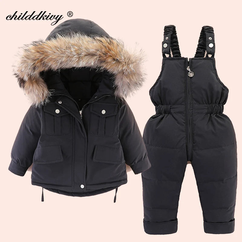 A black baby winter down jacket and pants set with a faux fur hood displayed on a light background.