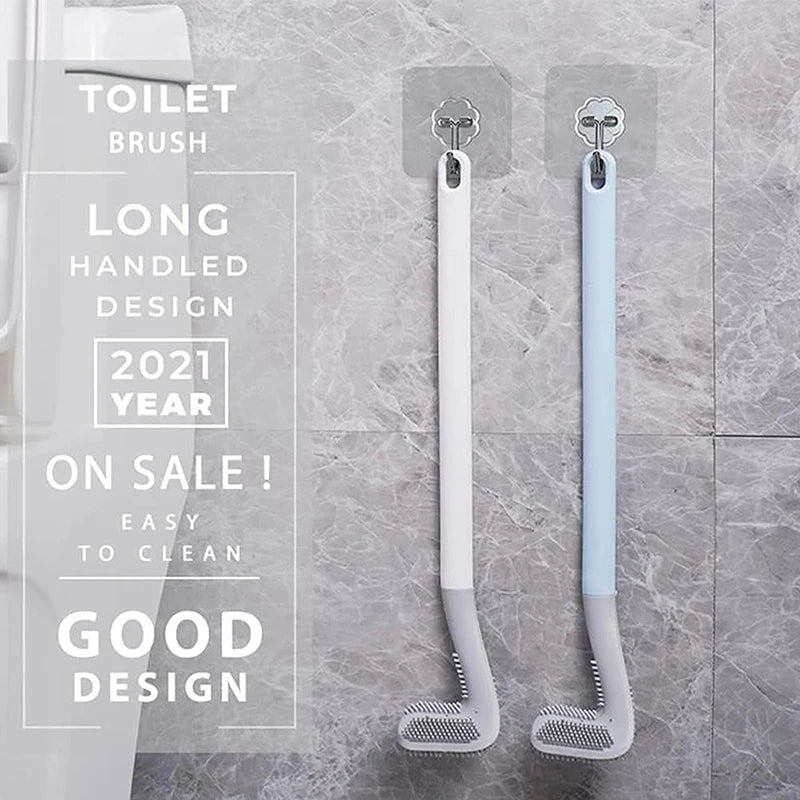 A pair of long handled silicone toilet brushes in white and light blue are shown against a gray tiled background.
