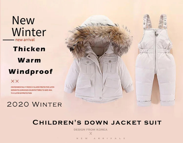 A white children's down jacket suit with a faux fur hood shown flat lay.