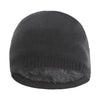 A dark gray knitted winter beanie hat with a fuzzy trim.