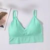 A mint green seamless U-back bralette top with a ribbed texture displayed on a white background.
