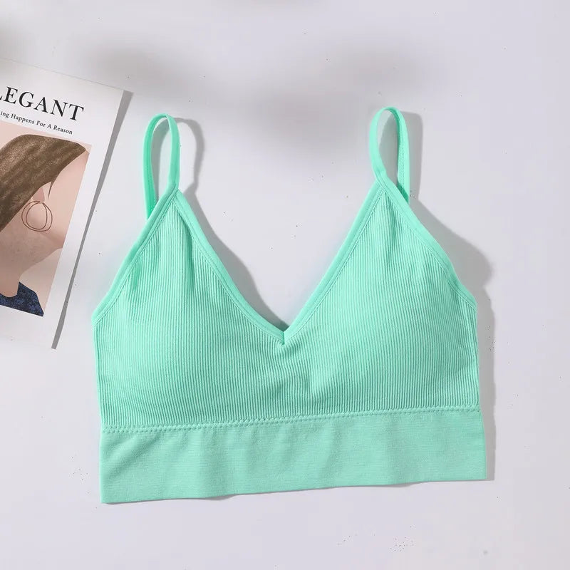 A mint green seamless U-back bralette top with a ribbed texture displayed on a white background.