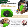 A green bug-shaped squeaky dog chew toy being held by a dog.