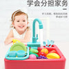 A pink plastic kitchen sink set with an electric water circulation faucet and various colorful fruits and vegetables for chil
