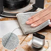 A hand is using a gray scratch-free microfiber cleaning cloth to wipe a surface, demonstrating its use for kitchen and home c